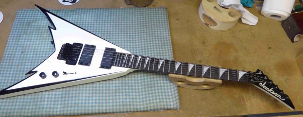 Jackson guitar on the bench before any work was carried out