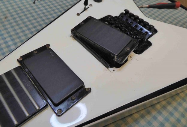 Pickups removed from a Jackson in order to replace the pickup surrounds