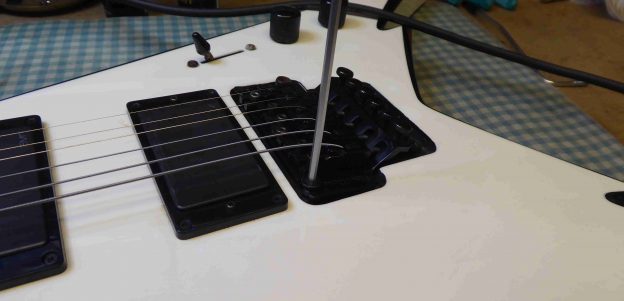 Adjusting the bridge action height on a Floyd Rose tremolo fitted to a Jackson Guitar