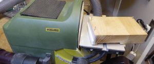 grinding a bone saddle blank to fit a Martin acoustic guitar