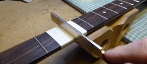 Re-crowning the top of a dressed fret
