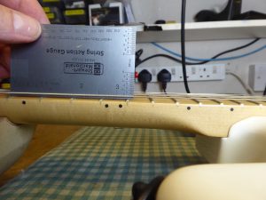 Measuring the action heigh at the 12th fret on a fender stratocaster