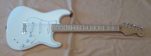A white U S made Fender Stratocaster