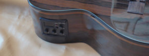 Pre-amplifier tuner mounted in the side of a ukulele