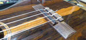 Strings and bridge saddle re-fitted to the ukulele