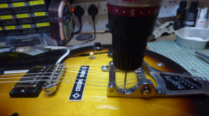 Drilling the screw holes in the top of a Gibson ES335 for a new Bigsby tremolo
