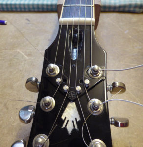String Butler mounted on the head of a Gibson ES335
